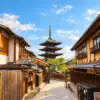 Yasaka Pagoda at the end of a traditional street lined with wooden buildings in Kyoto’s Higashiyama district.