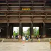 Deer and visitors beside the large wooden Nandaimon gate at Todai-ji in Nara.